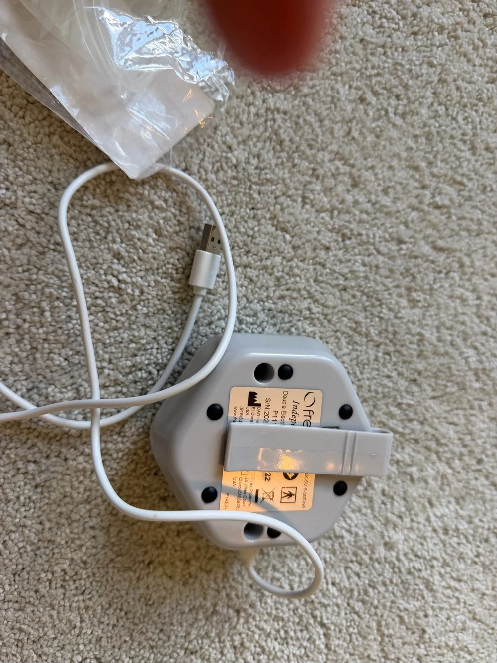 White Portable Electronic Wearable Charger with Control Buttons